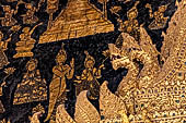 Wat Xieng Thong temple in Luang Prabang, Laos. The main entrance of the sim. Detail of the nagas at the sides of the  in the  that  